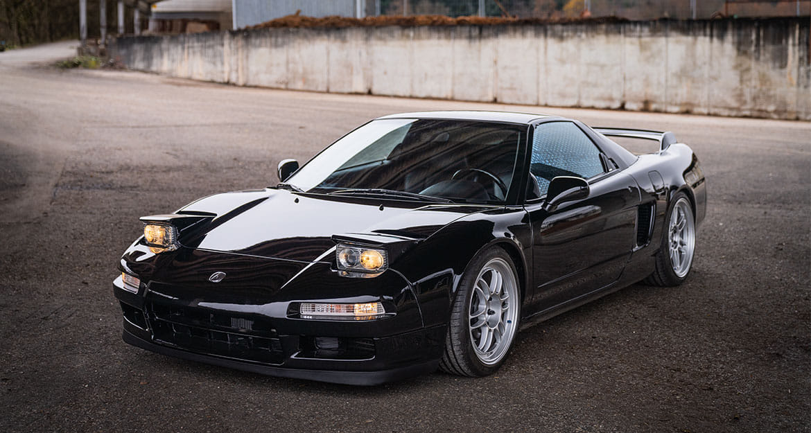 Front view of a black Honda (Acura) NSX NA1 with KW coilover suspension from JP Performance