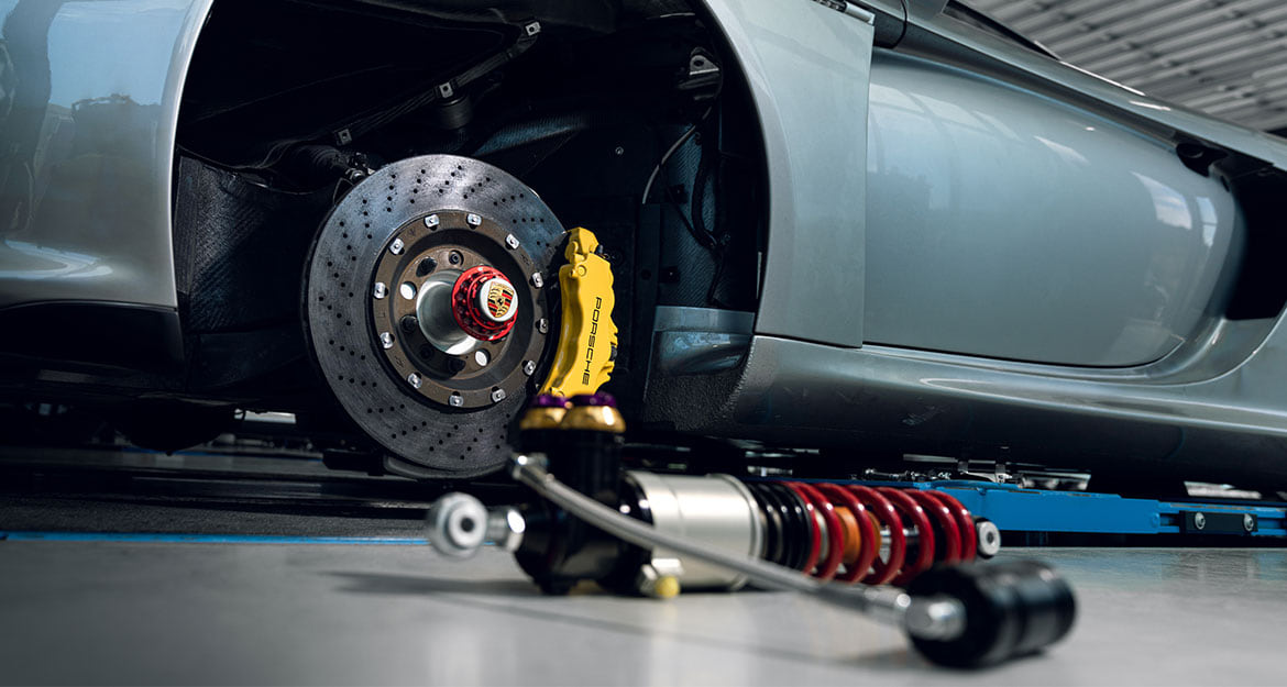 The Carrera GT shortly before installing the V5 coilover kit. The red and blue wheel nuts are especially striking.